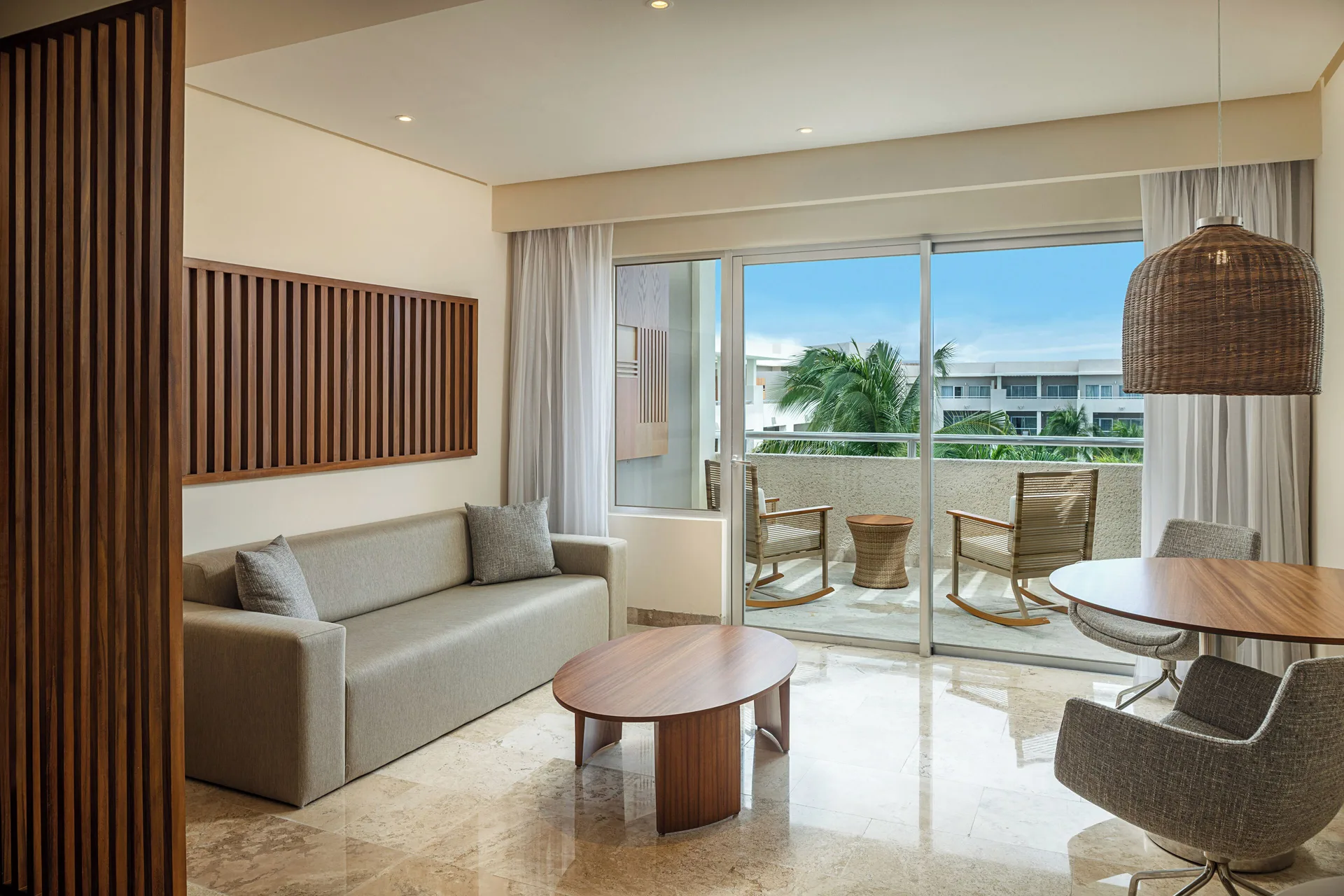 Junior Suite Nature View living area and balcony at Paradisus La Perla Riviera Maya.