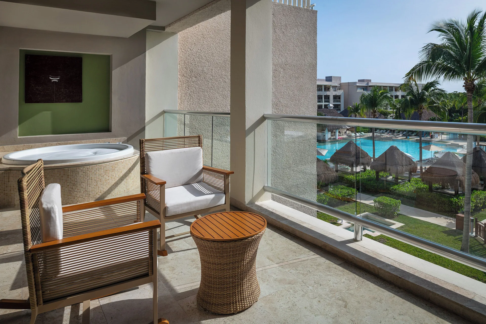 Master Suite Nature View balcony with seating and whirlpool at Paradisus La Perla Riviera Maya.