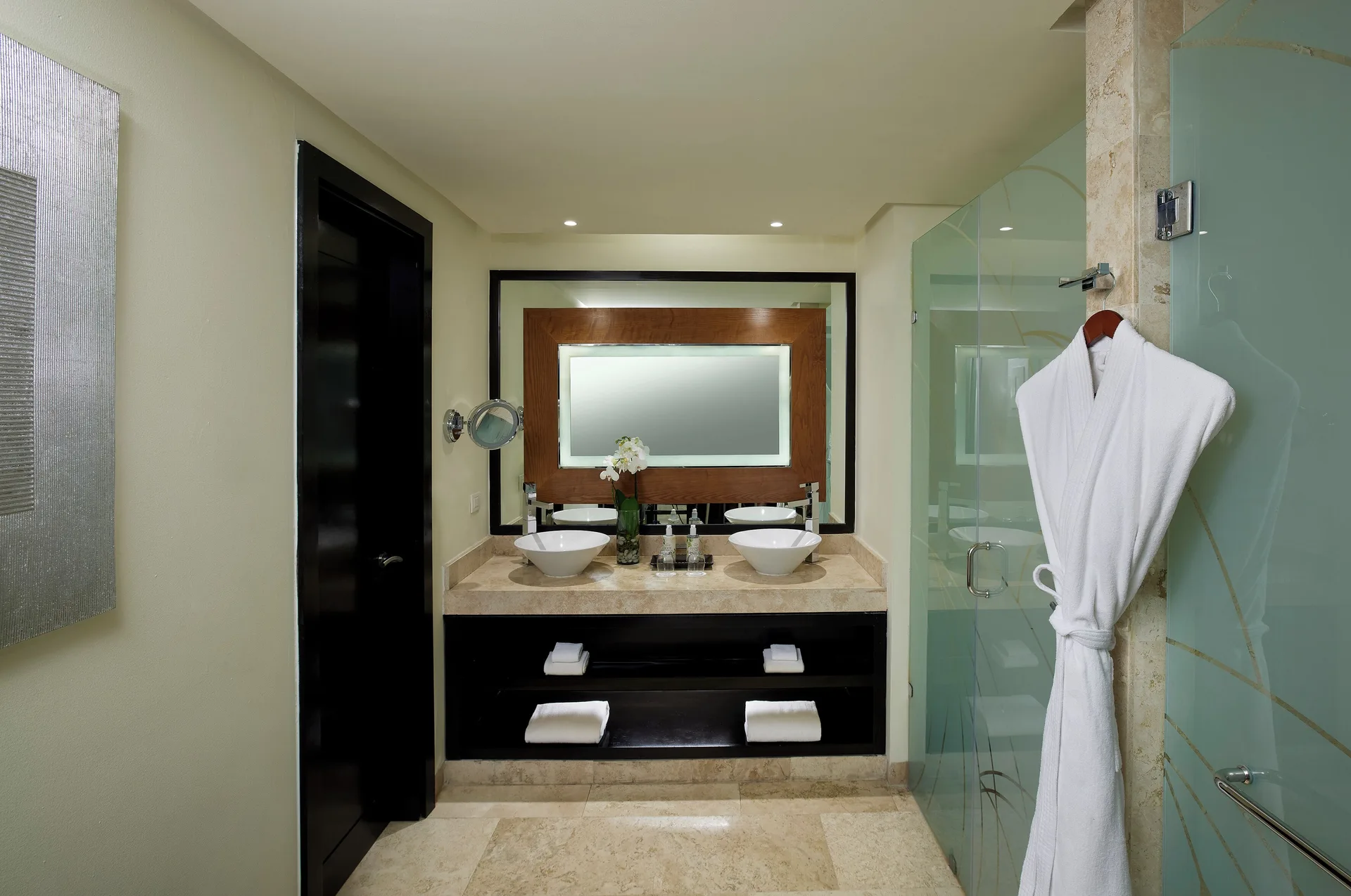 Suite Nature View bathroom with double vanity and glass shower at Paradisus La Perla Riviera Maya.