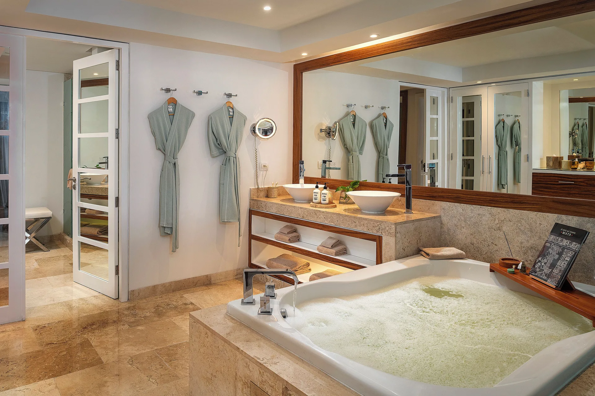 Bathroom tub and vanity in The Reserve Master Suite Nature View at Paradisus La Perla Riviera Maya.