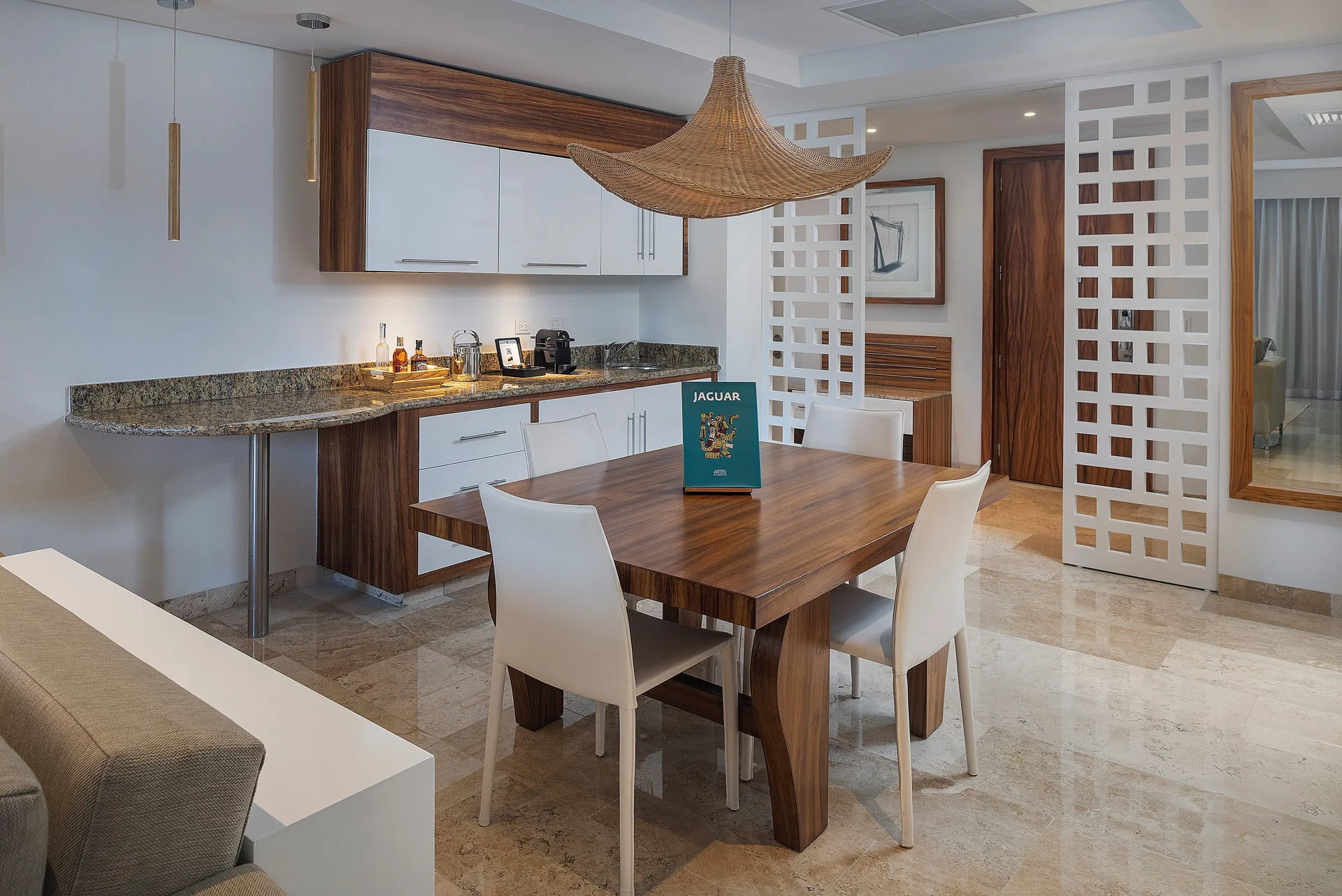 Dining and kitchenette area in The Reserve Master Suite Nature View at Paradisus La Perla Riviera Maya.