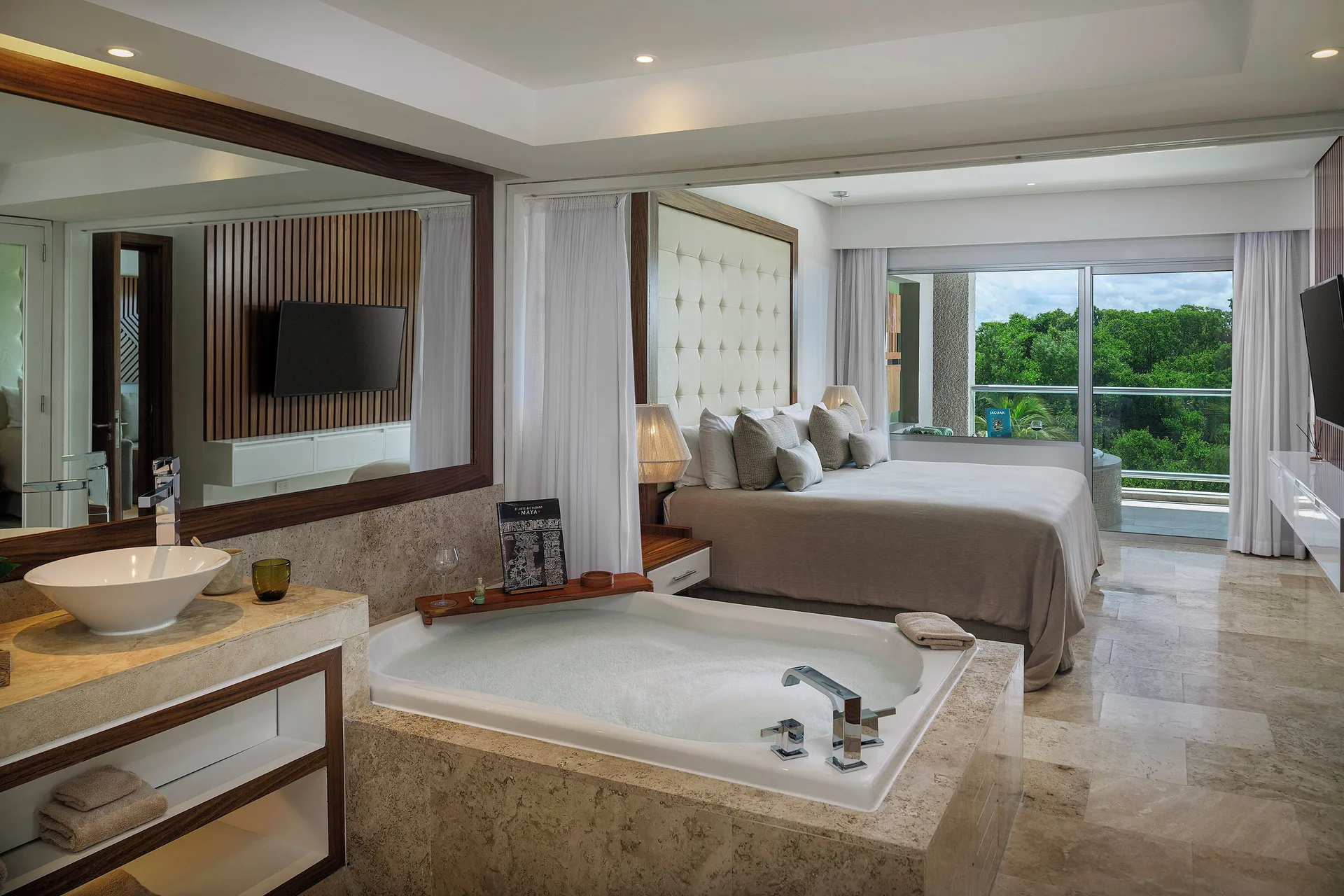 King bed and soaking tub in The Reserve Master Suite Nature View at Paradisus La Perla Riviera Maya.