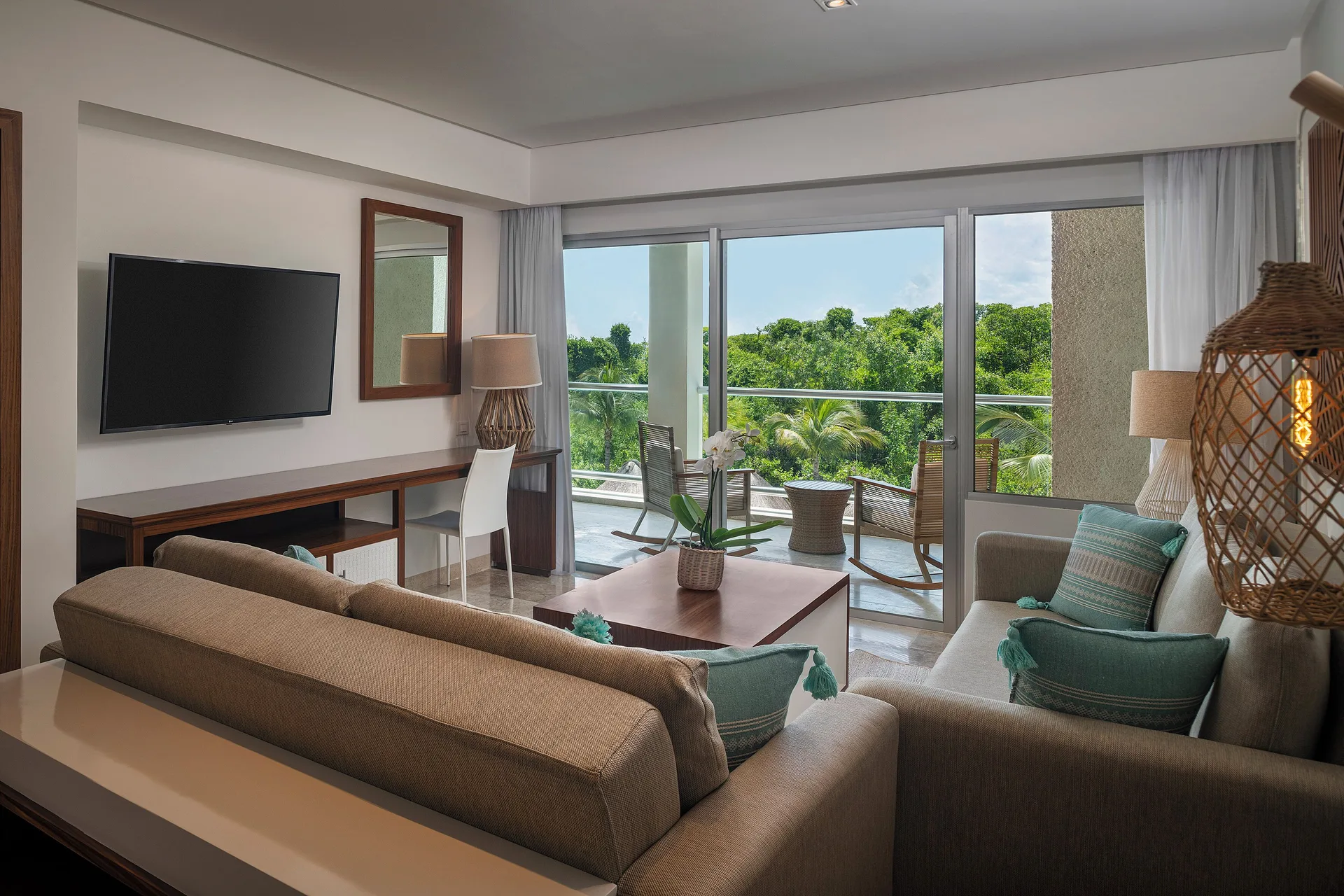 Nature-view living room balcony in The Reserve Master Suite at Paradisus La Perla Riviera Maya.