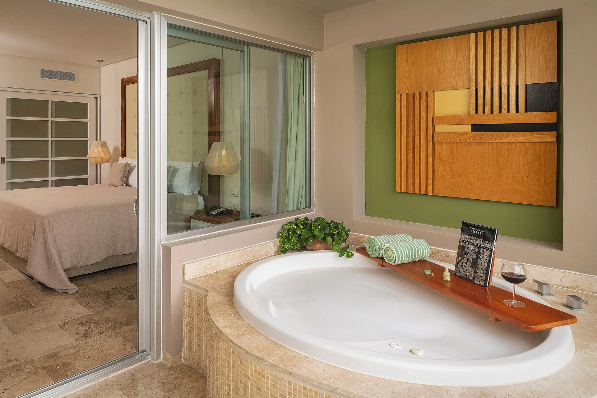 Reserve Master Suite Swim Up terrace tub and bedroom at Paradisus La Perla Riviera Maya.