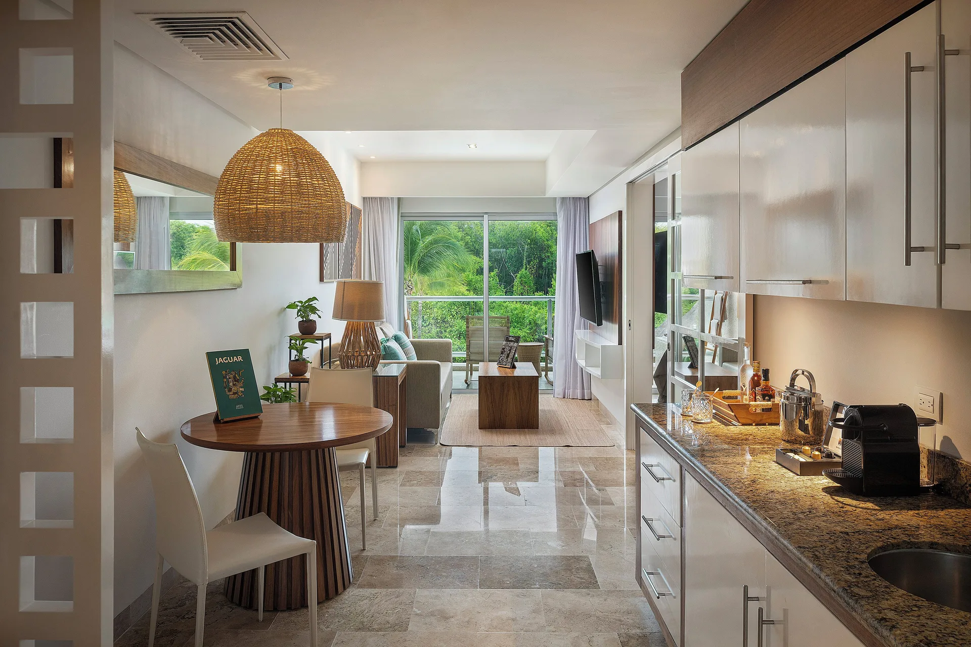 The Reserve Nature View suite kitchenette and living area at Paradisus La Perla Riviera Maya.