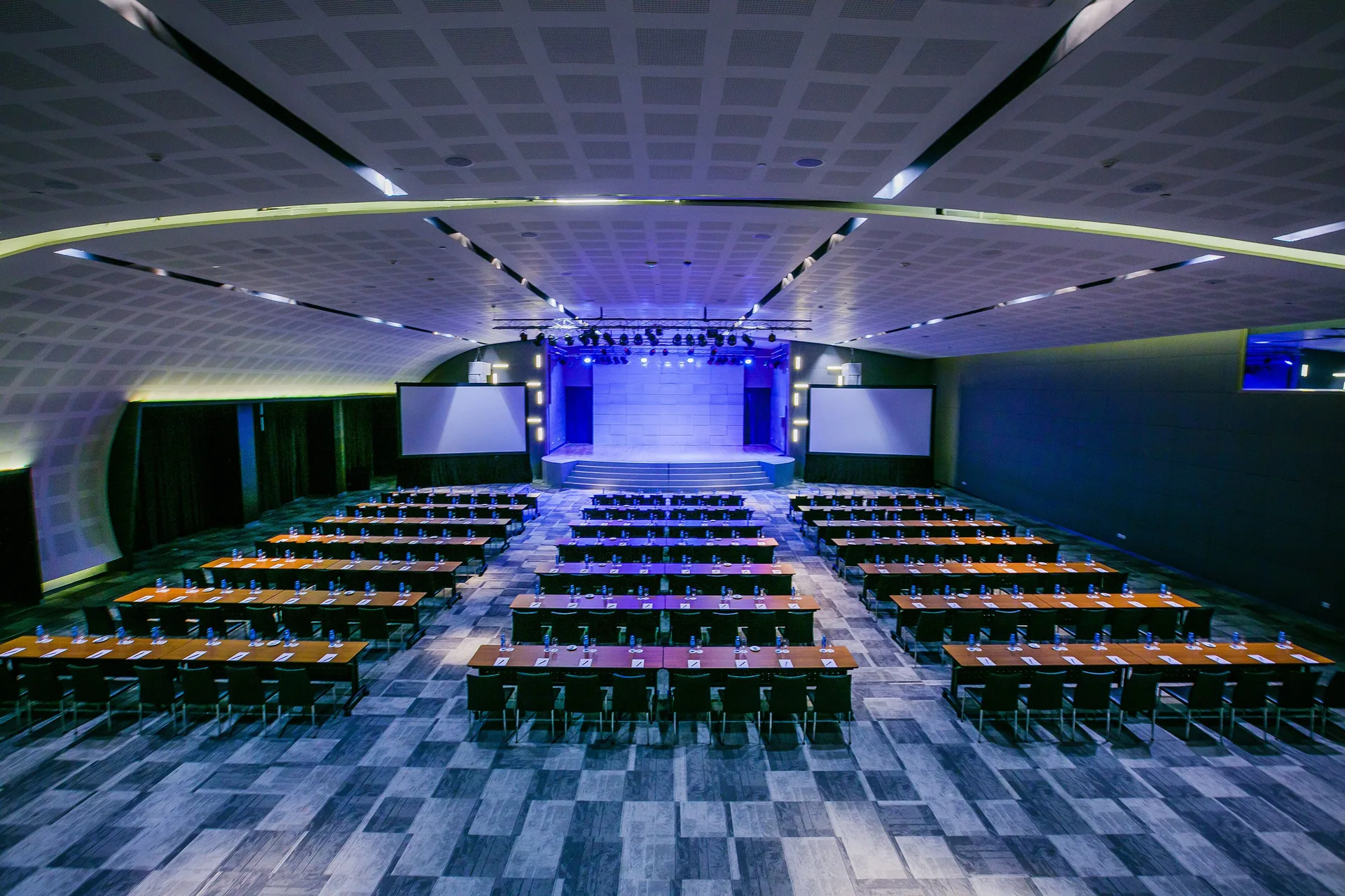 Large conference hall with classroom seating at Paradisus La Perla Riviera Maya.