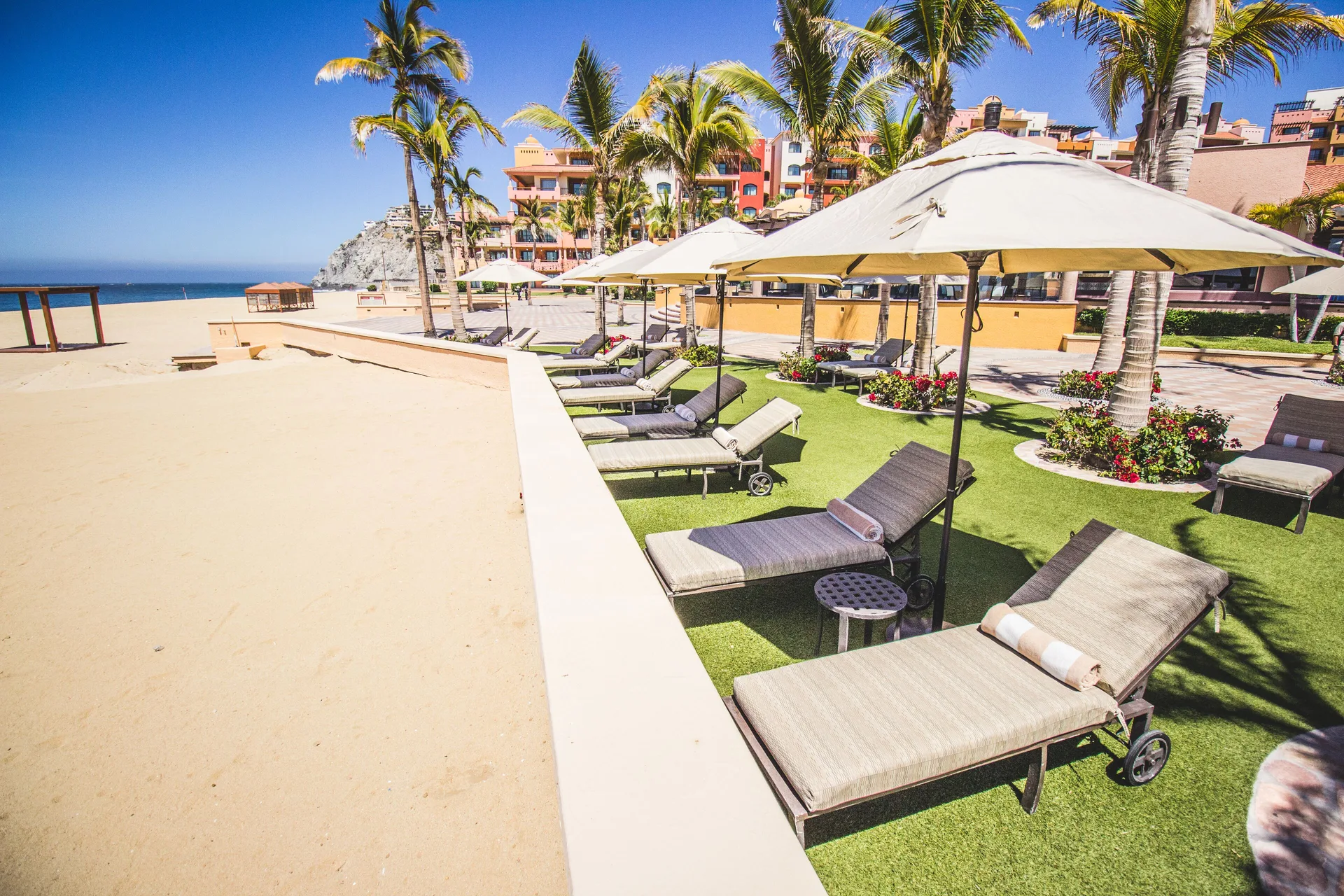 Beachfront loungers and umbrellas at Playa Grande Resort & Grand Spa.