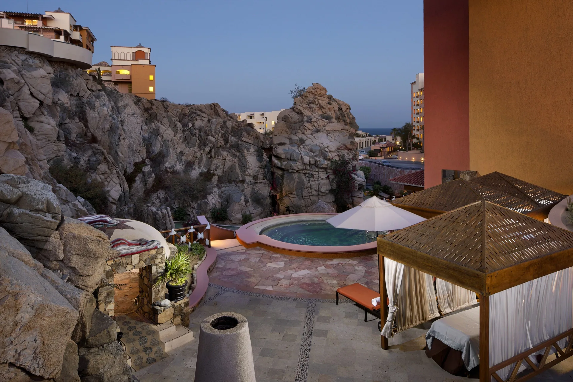 Outdoor spa terrace with cabana, plunge pool and rock formations at Playa Grande Resort & Grand Spa.