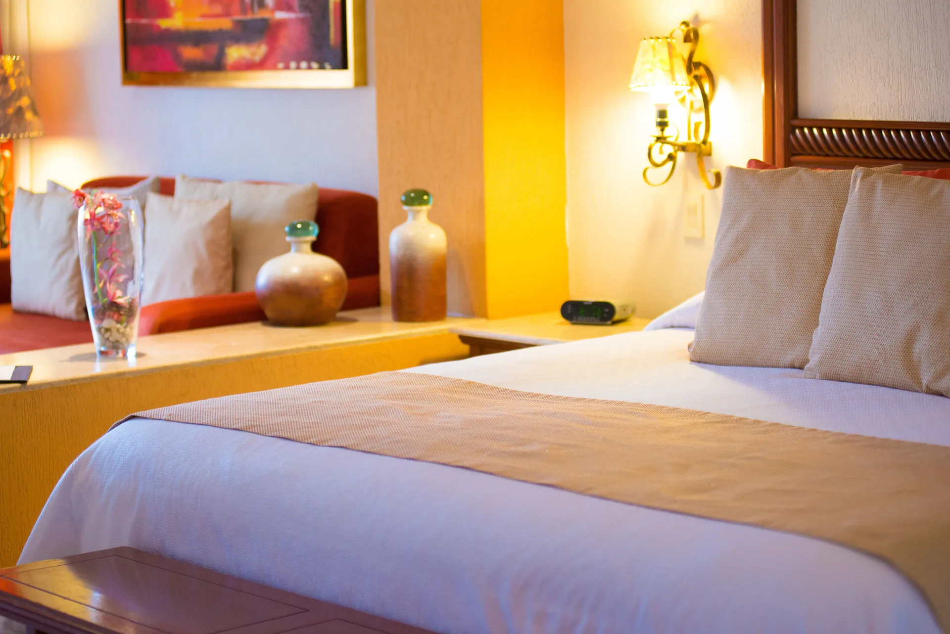 Junior Studio bed and sofa seating area at Playa Grande Resort & Grand Spa.