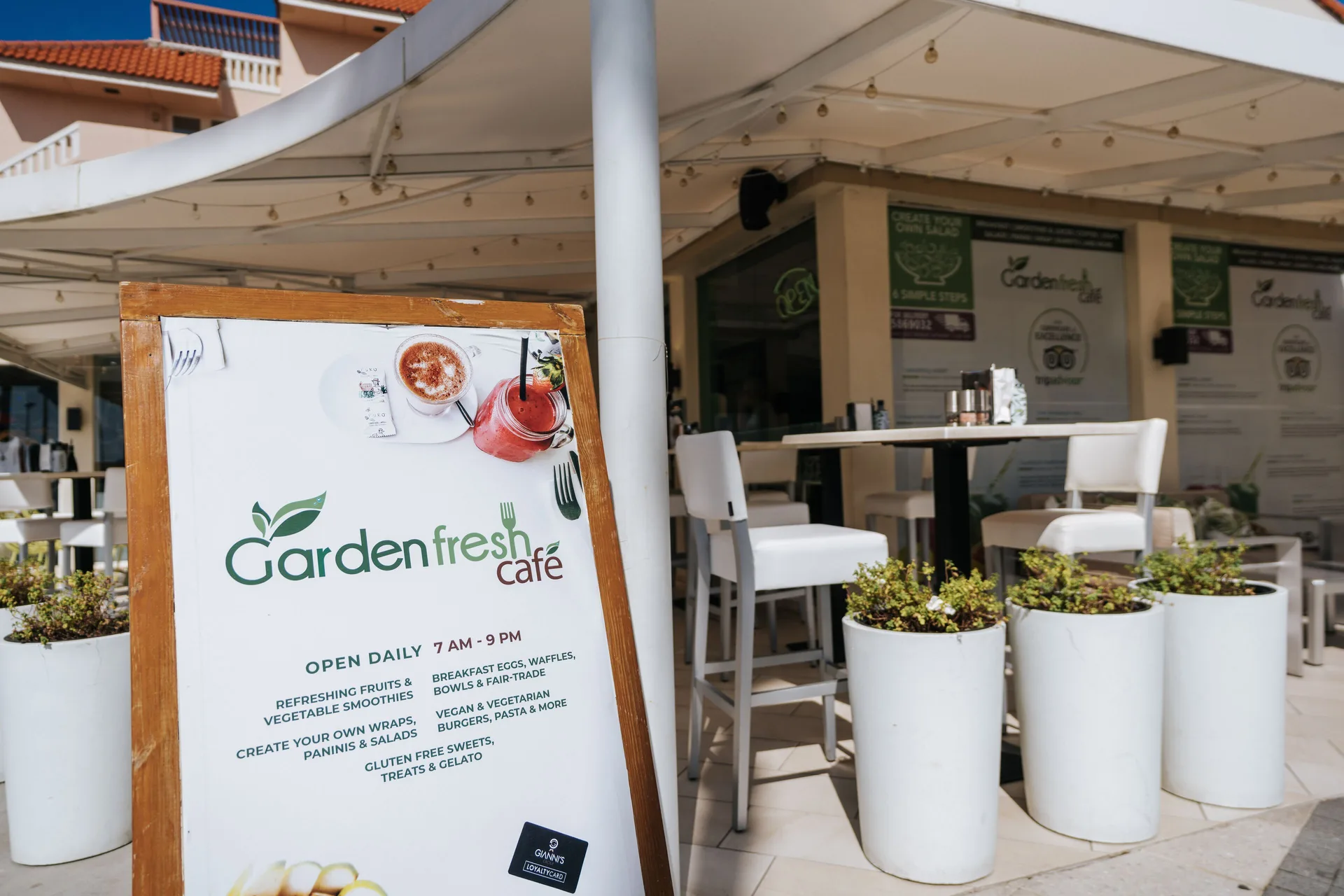 Gardenfresh Cafe sign and outdoor seating at Playa Linda Beach Resort.