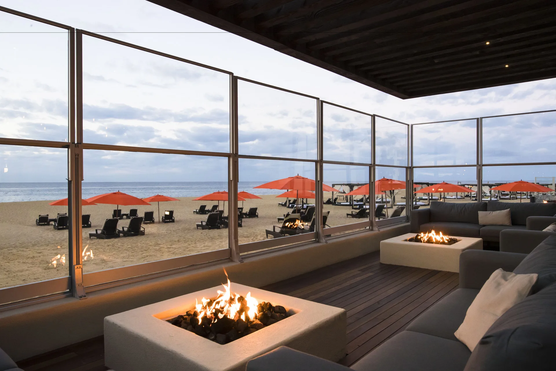 Beachfront lounge with fire pits at Pueblo Bonito Pacifica Golf & Spa Resort.