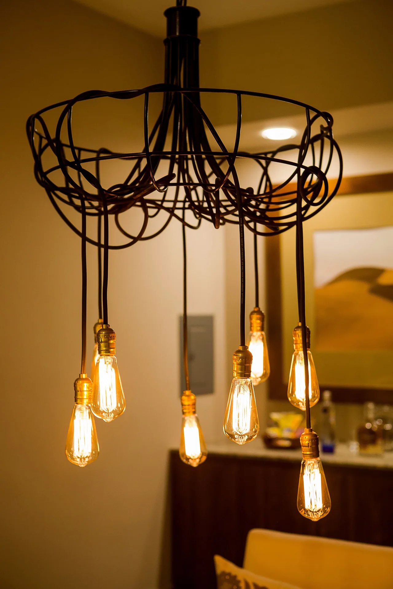 Hanging Edison-bulb chandelier in a guest room at Pueblo Bonito Pacifica Golf & Spa Resort.