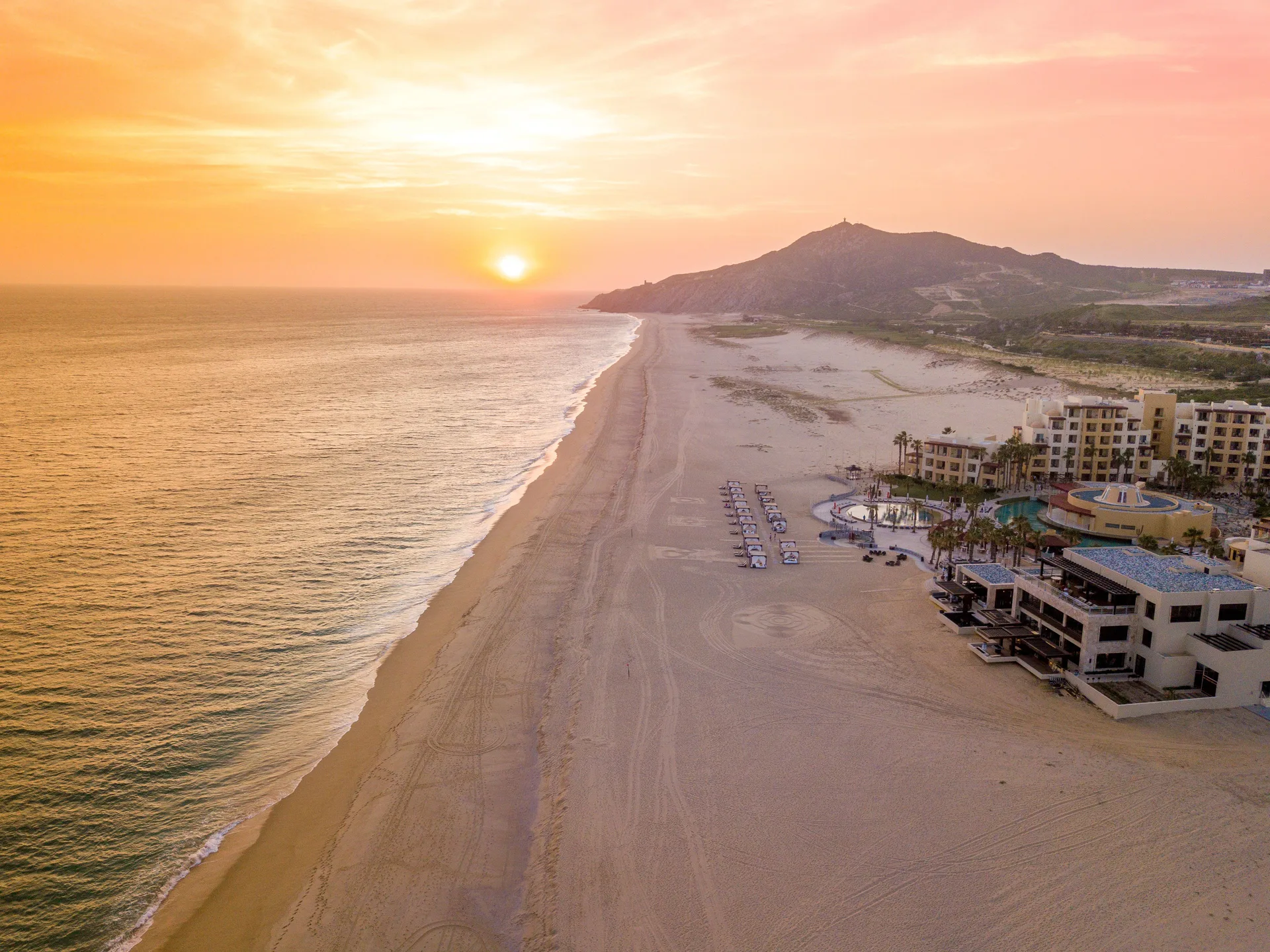 Sunset over the beach and ocean beside Pueblo Bonito Pacifica Golf & Spa Resort.