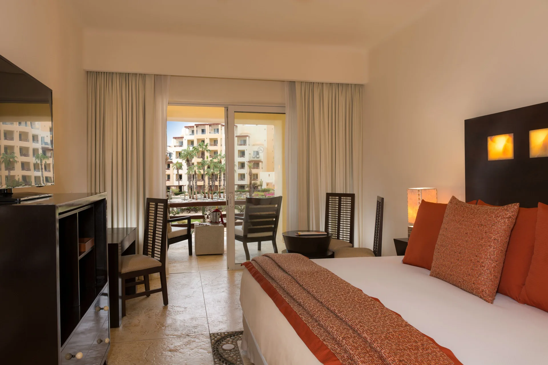 Deluxe Room with king bed and balcony at Pueblo Bonito Pacifica Golf & Spa Resort.