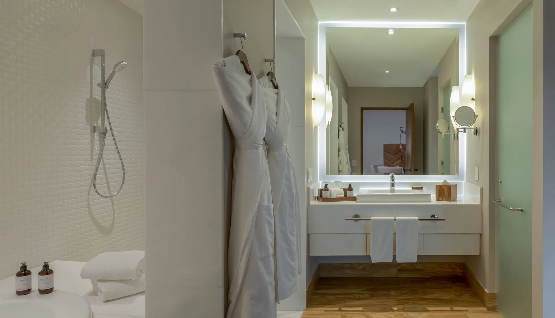 Bathroom with robes in a Towers Private Pool Suite at Pueblo Bonito Pacifica Golf & Spa Resort.