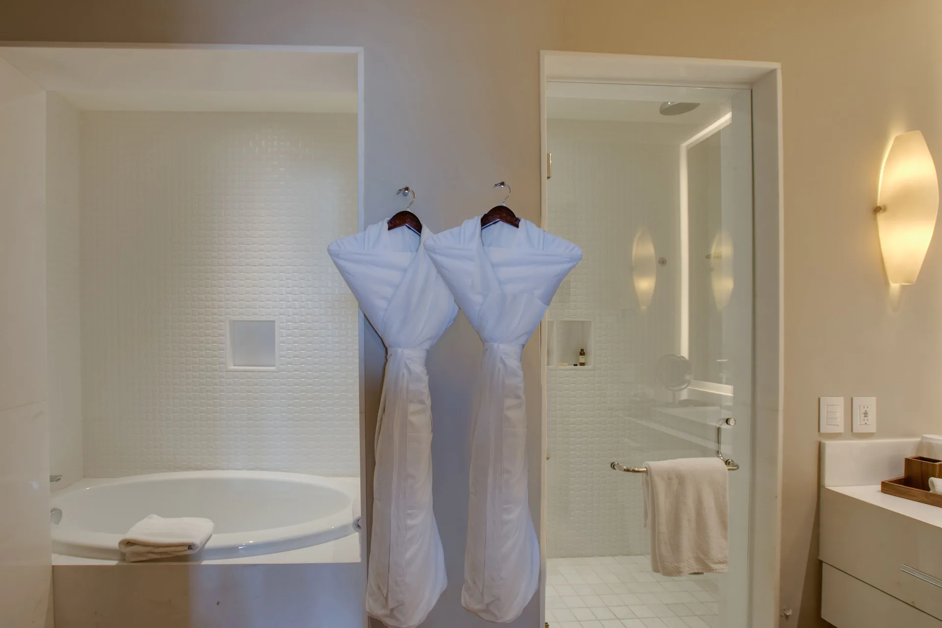 Towers Private Pool Suite bathroom at Pueblo Bonito Pacifica Golf & Spa Resort with tub, shower, and robes.