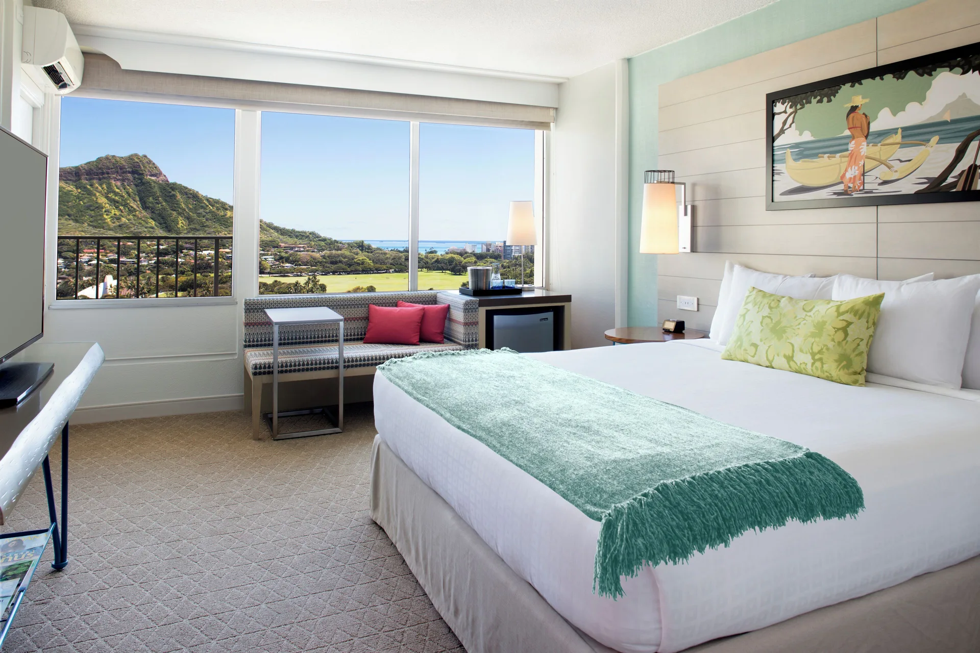 King guest room with Diamond Head and ocean views at Queen Kapiolani Hotel.