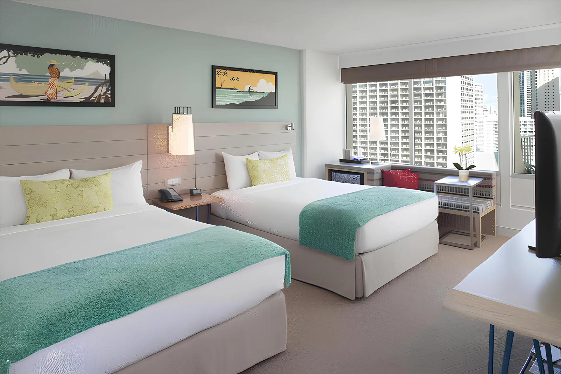 City view guest room with two beds and balcony at Queen Kapiolani Hotel.