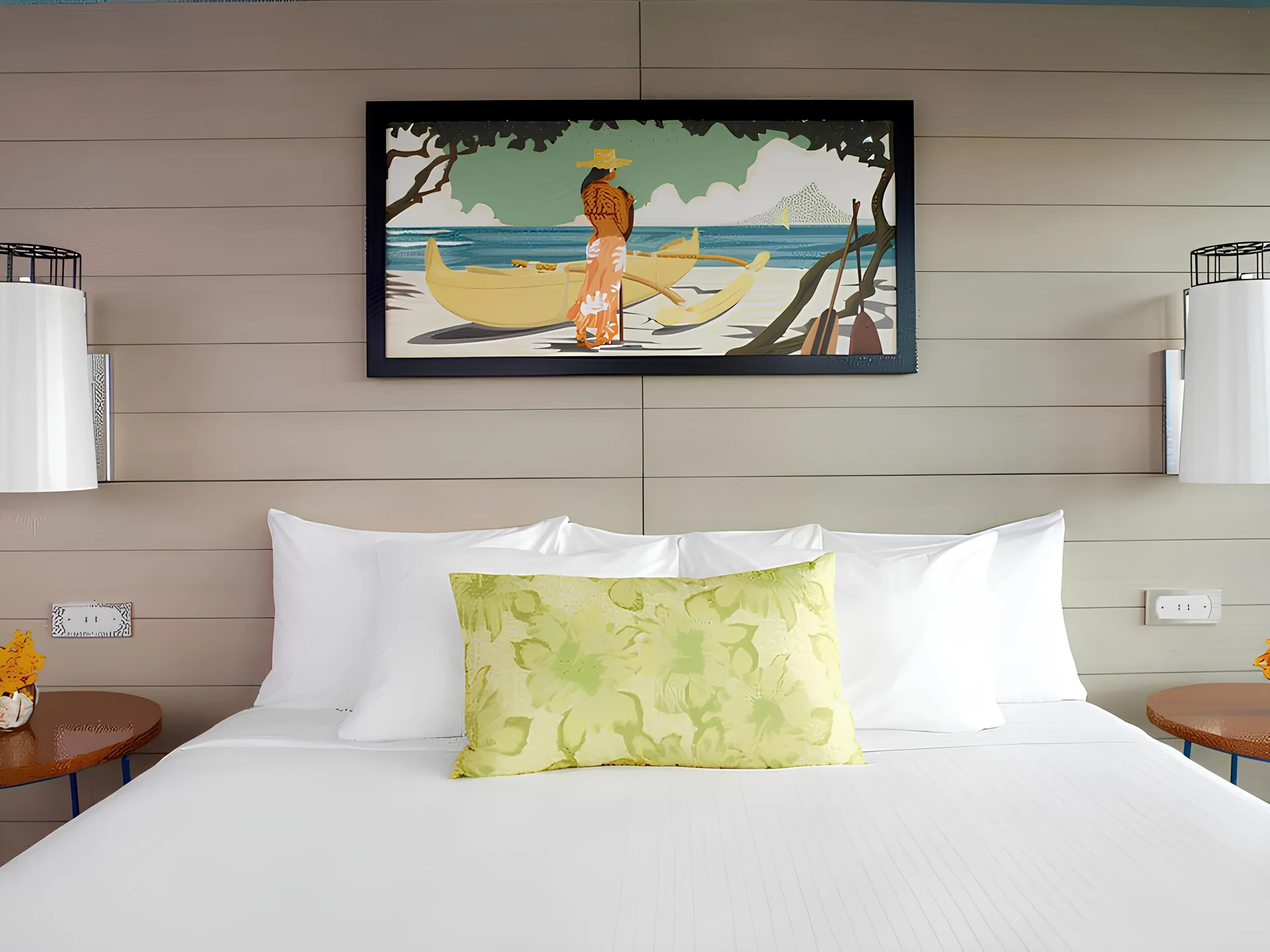 Studio City View king bed with beach artwork at Queen Kapiolani Hotel.