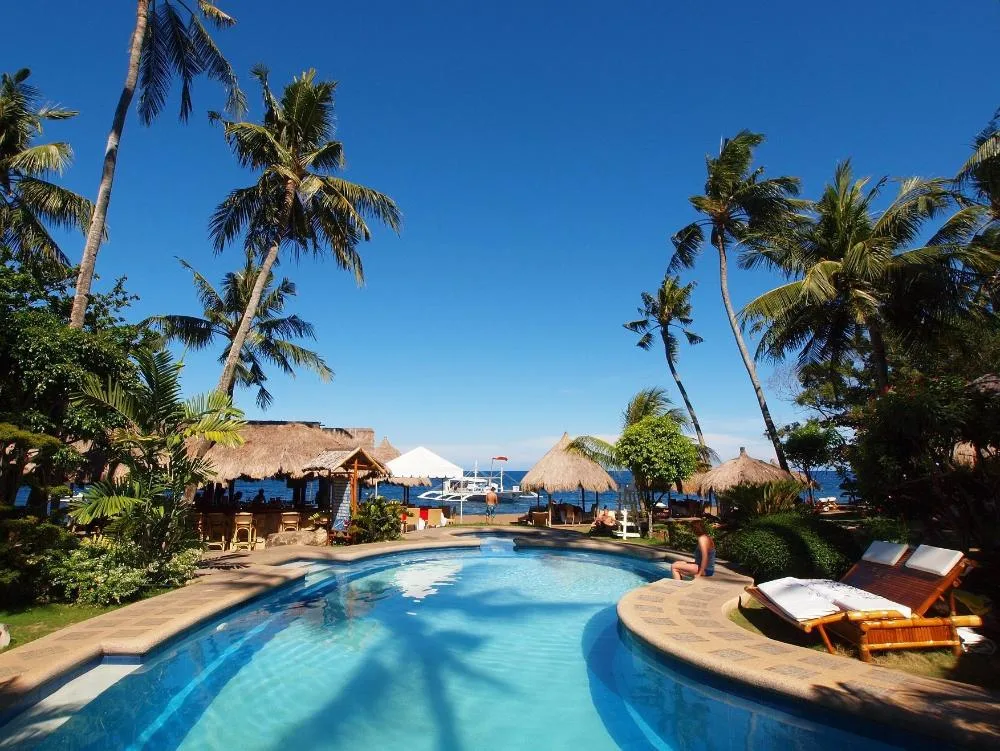 Pura Vida Beach and Dive Resort Dauin beachfront dive resort with tropical gardens and pool