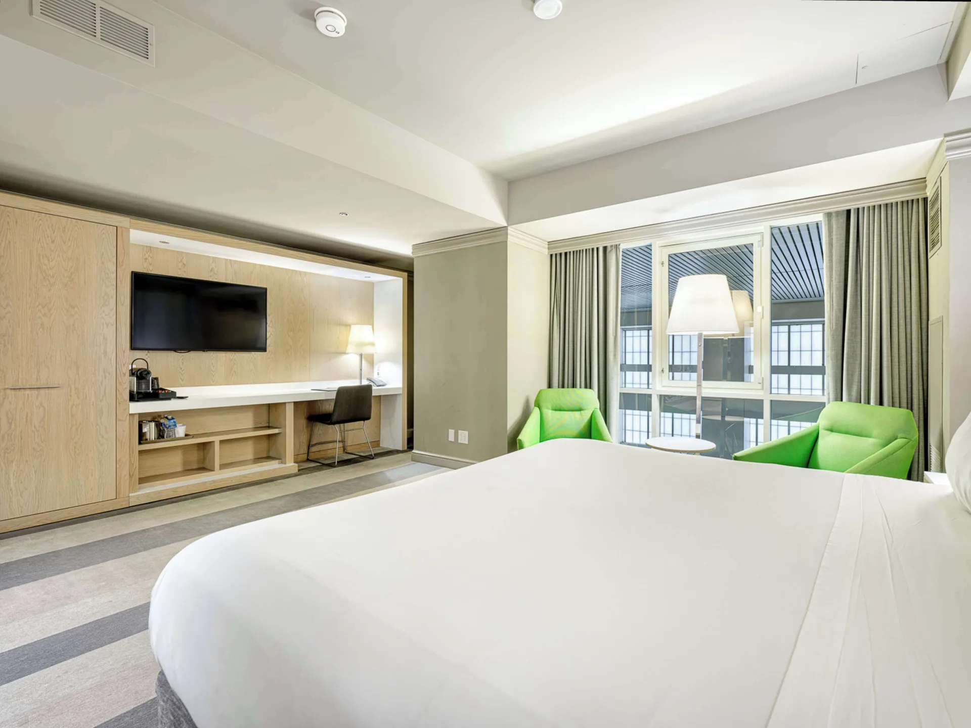 Room Superior king bed at Royal Sonesta Minneapolis Downtown with contemporary design, comfortable workspace, and downtown Minneapolis city views.