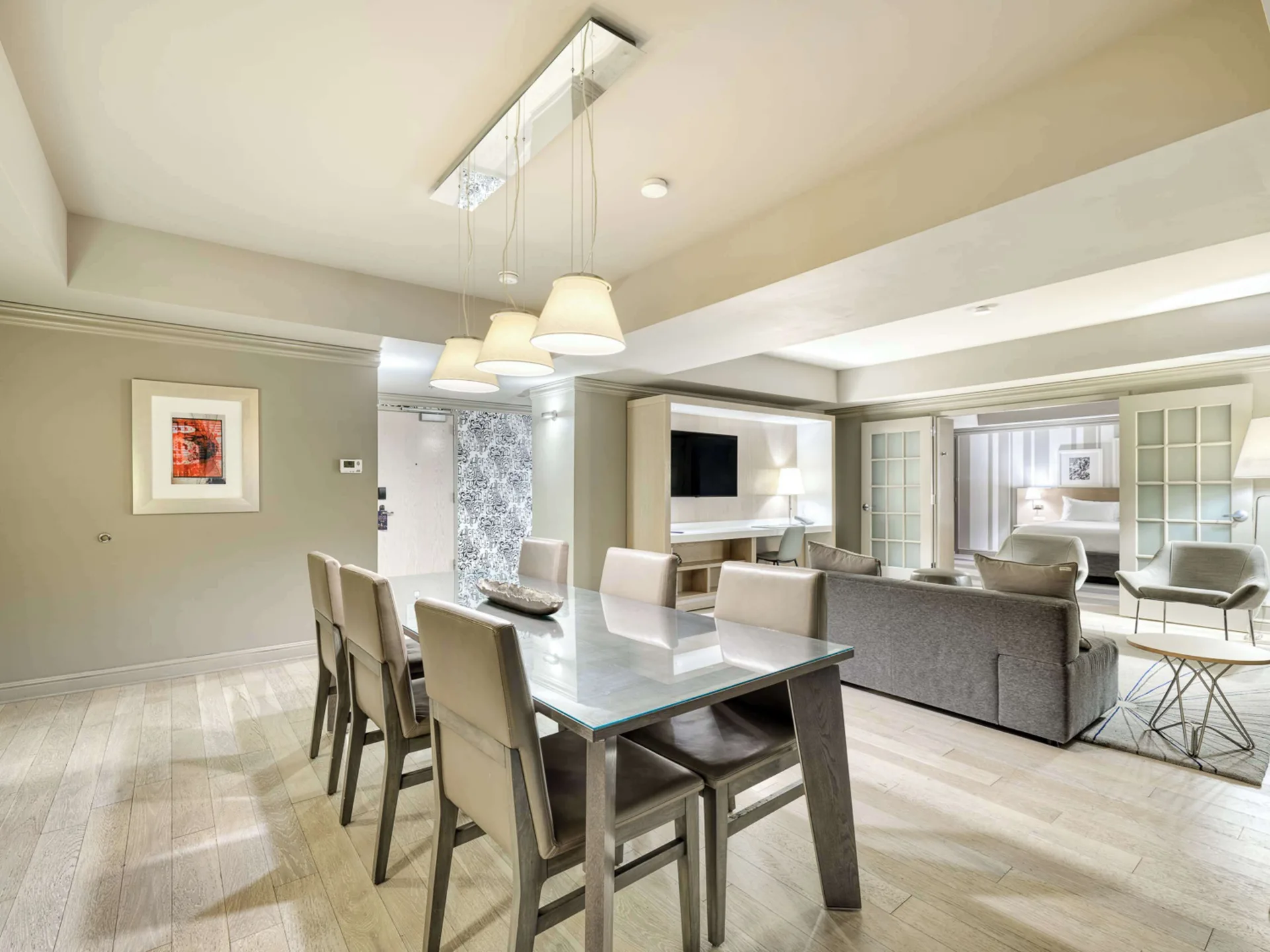Suite Luxury dining area and bedroom at Royal Sonesta Minneapolis Downtown with separate living space, modern furnishings, and upscale downtown Minneapolis accommodations.