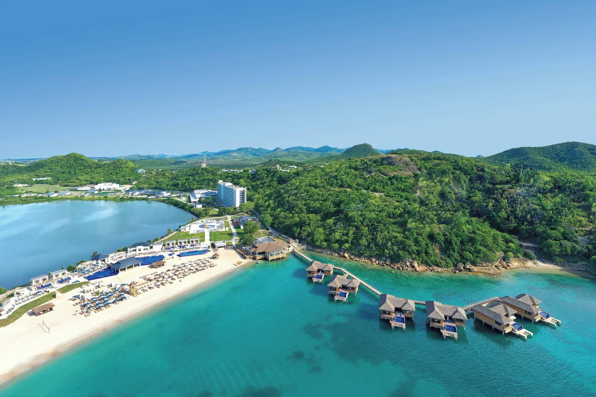 Royalton Antigua all-inclusive resort with modern suites, beach setting and overwater-style luxury options