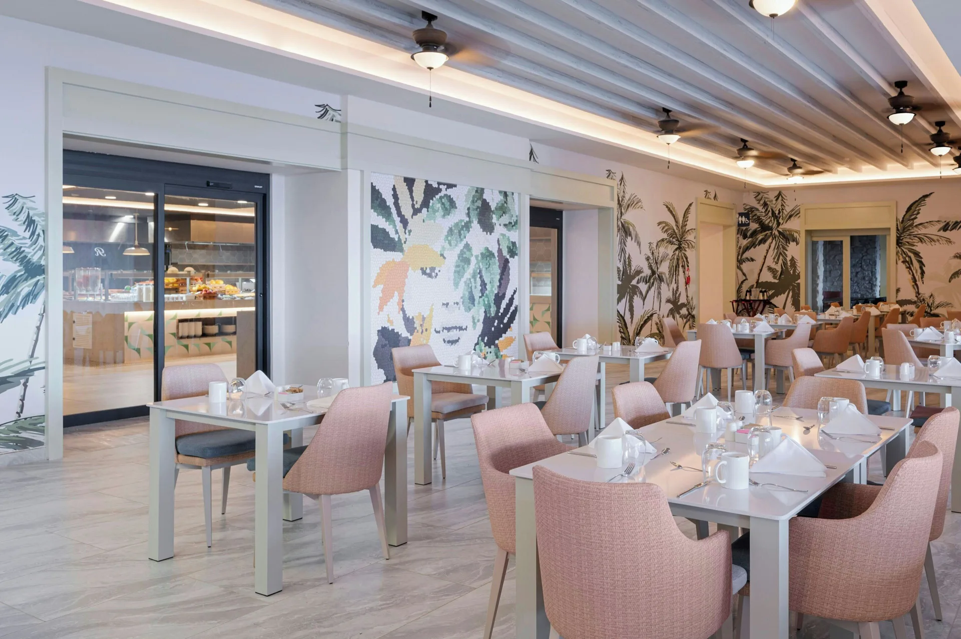 Buffet dining room with pale pink chairs at Royalton CHIC Antigua.