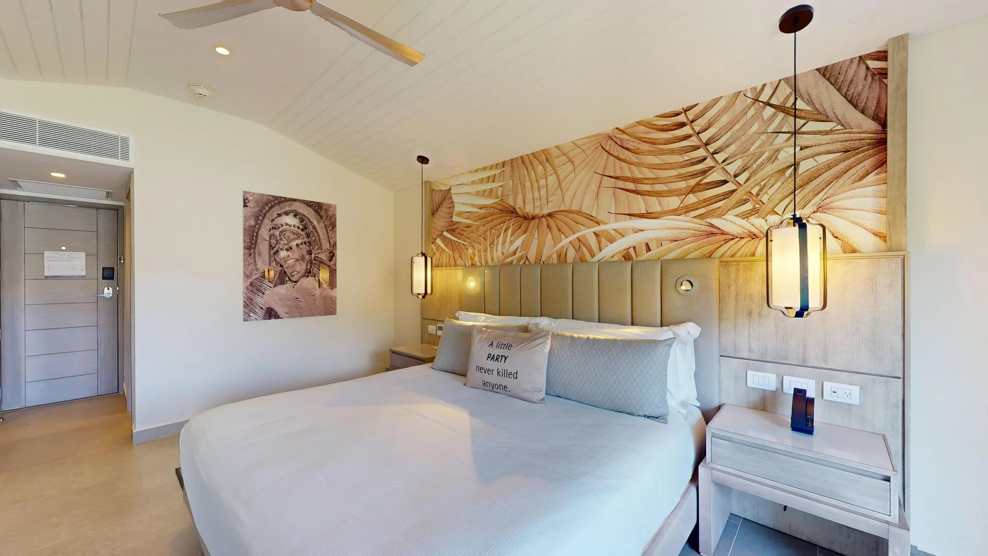Luxury Garden View Room king bed with pendant lights at Royalton CHIC Antigua.