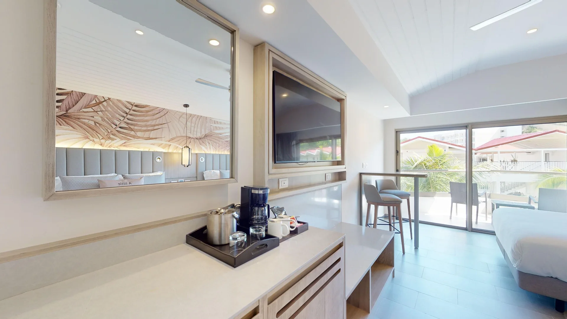 Luxury Garden View Room refreshment counter and balcony view at Royalton CHIC Antigua.