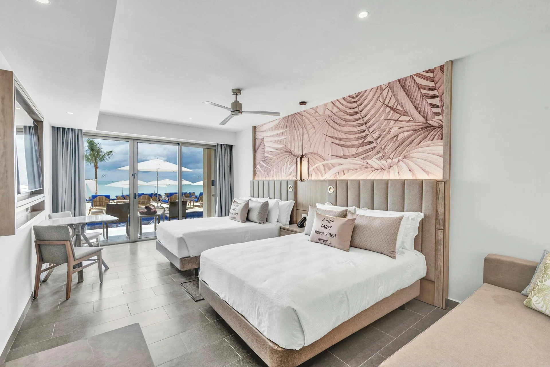 Luxury Garden View Room with two beds and balcony doors at Royalton CHIC Antigua.
