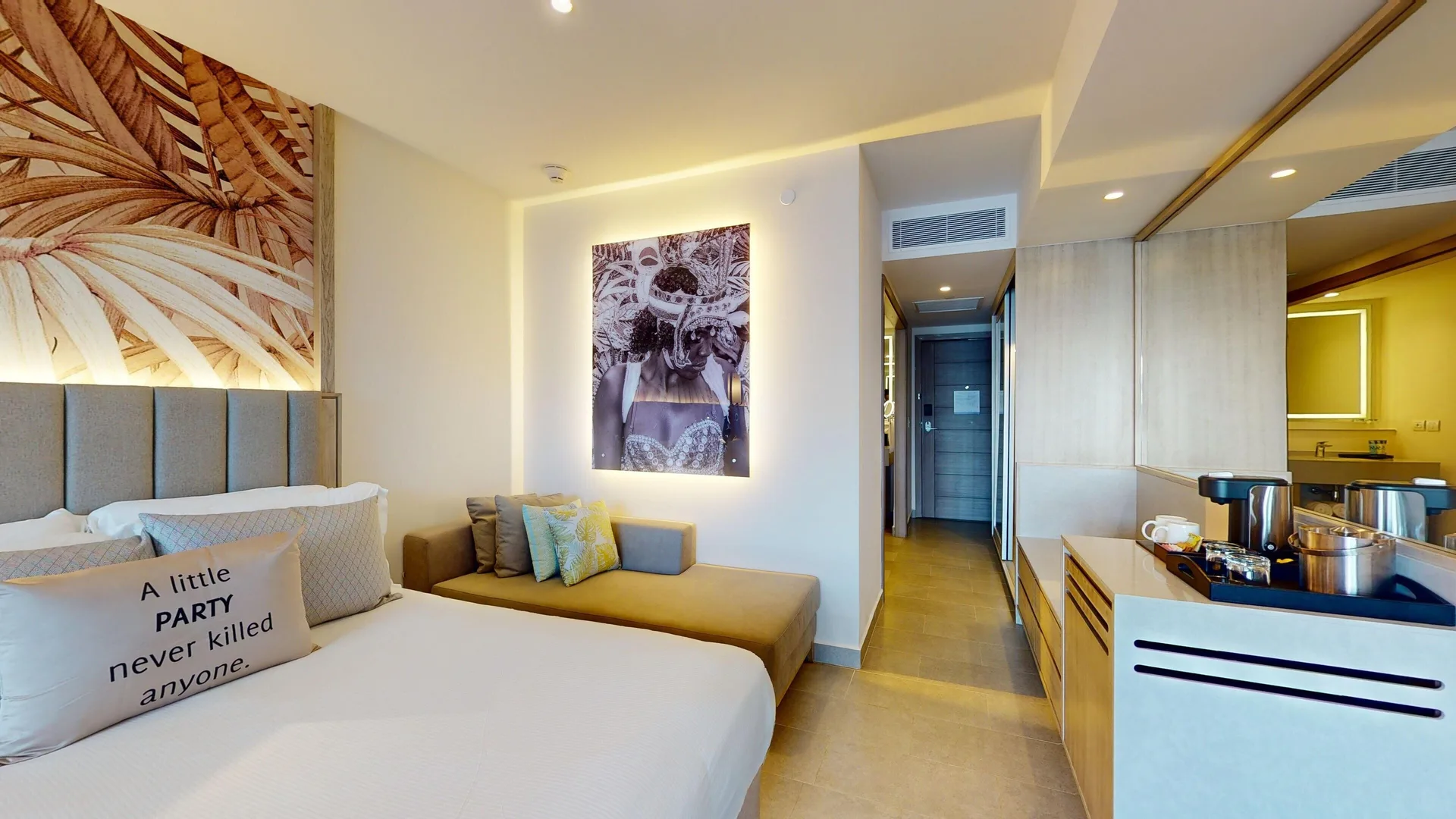 King bed and beverage station in a beachfront swim-out junior suite at Royalton CHIC Antigua.