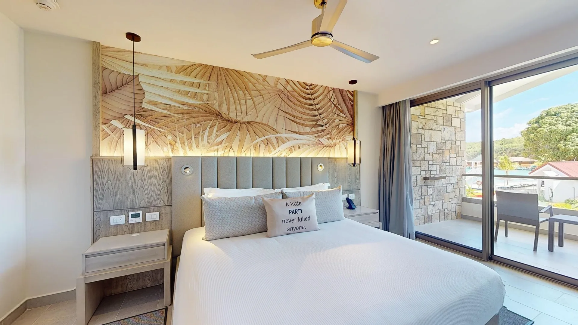 Luxury Ocean View Room king bed with balcony doors at Royalton CHIC Antigua.