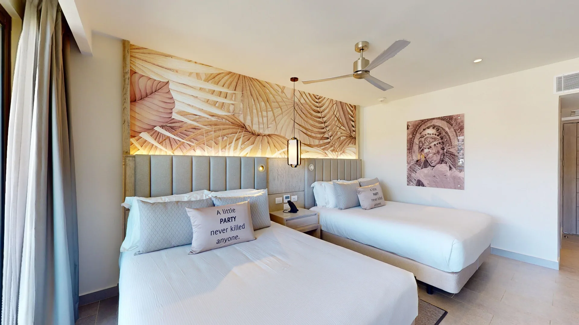 Luxury Ocean View Room with two beds and tropical decor at Royalton CHIC Antigua.