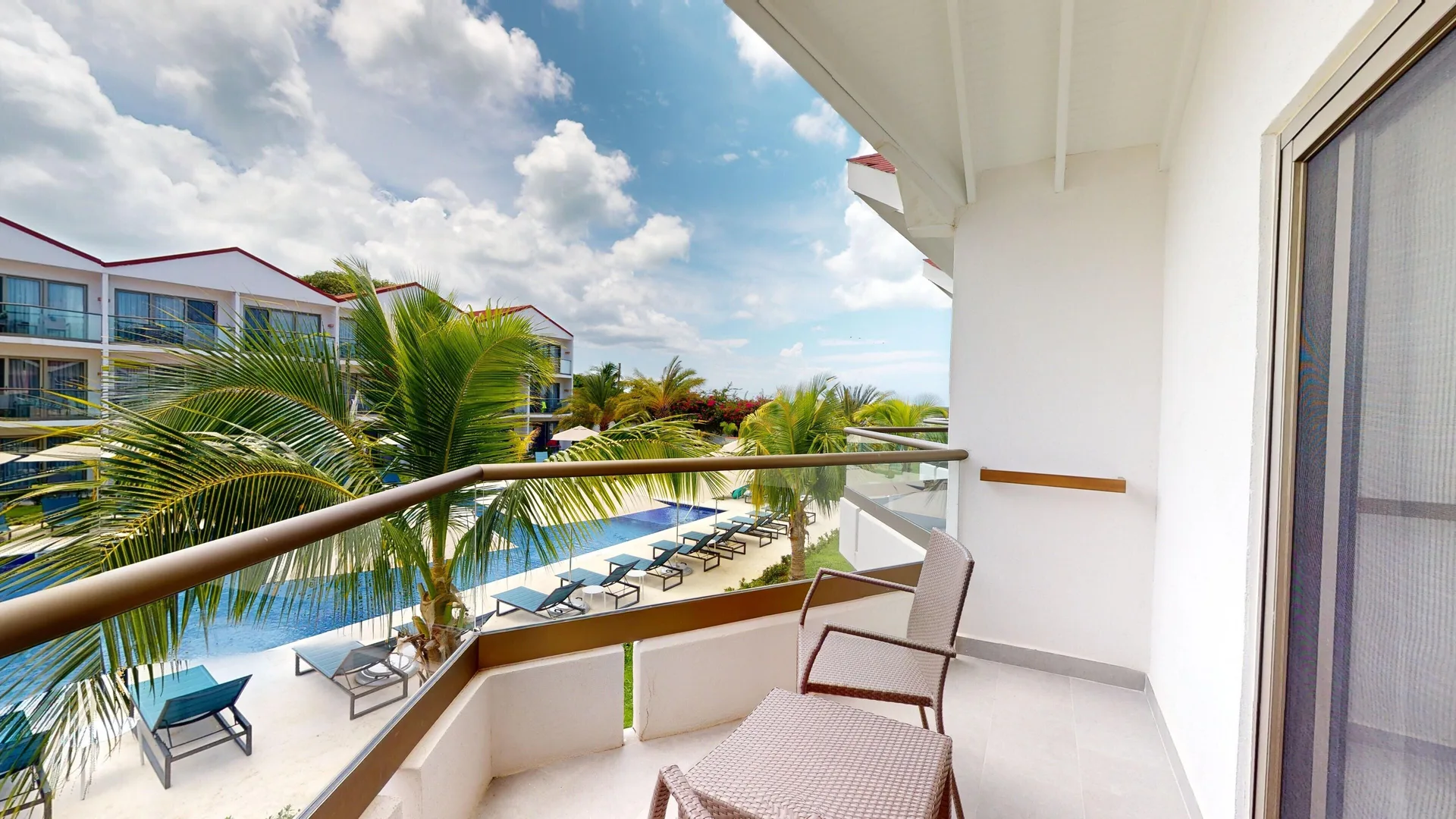 Luxury Pool View Room balcony overlooking the pool at Royalton CHIC Antigua.