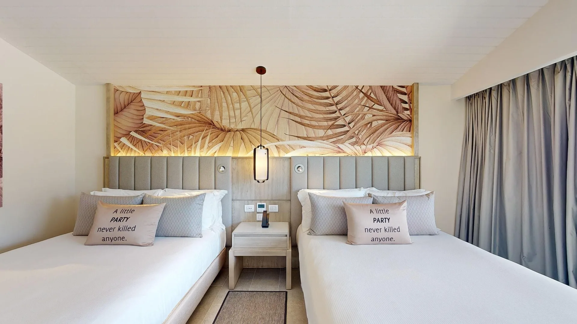 Luxury Pool View Room with two beds and centered pendant light at Royalton CHIC Antigua.