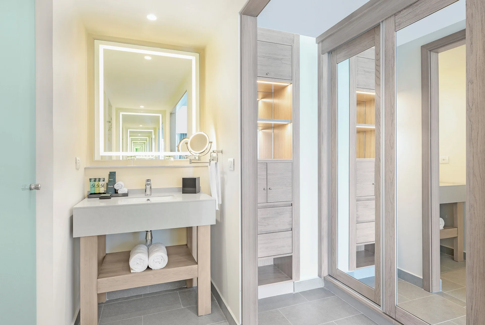 Suite bathroom vanity and mirrored closet at Royalton CHIC Antigua.