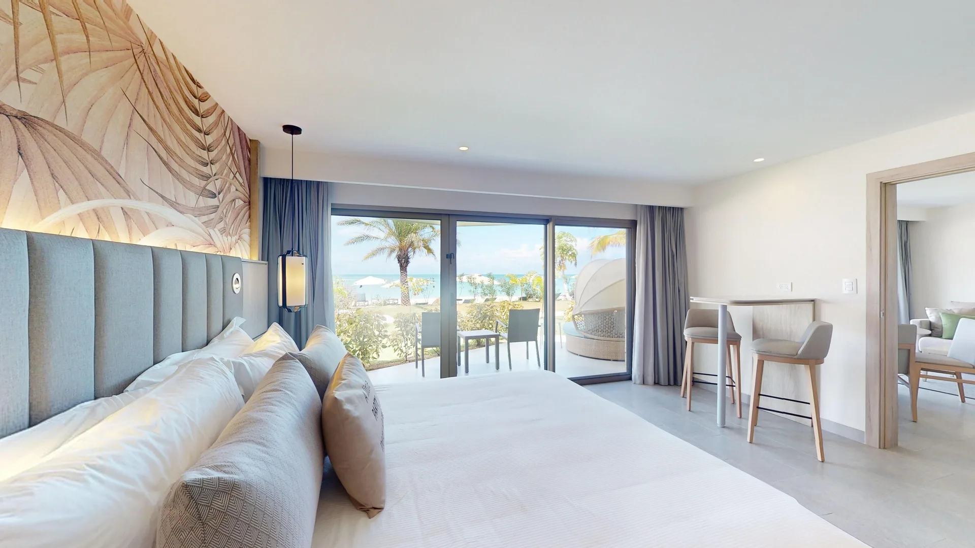 Luxury Presidential Beach Front Walkout One Bedroom Suite Diamond Club at Royalton CHIC Antigua with king bed, modern Caribbean design, and direct beach walkout access.