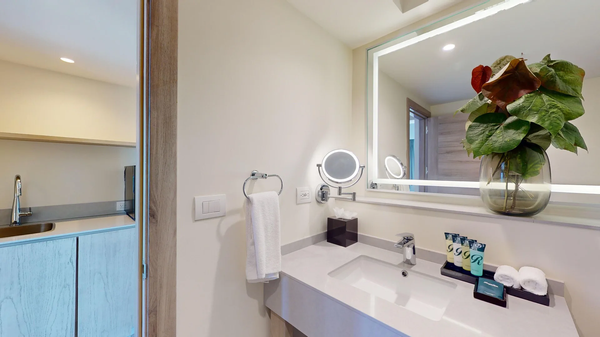Presidential suite bathroom vanity with mirror and amenities at Royalton CHIC Antigua.