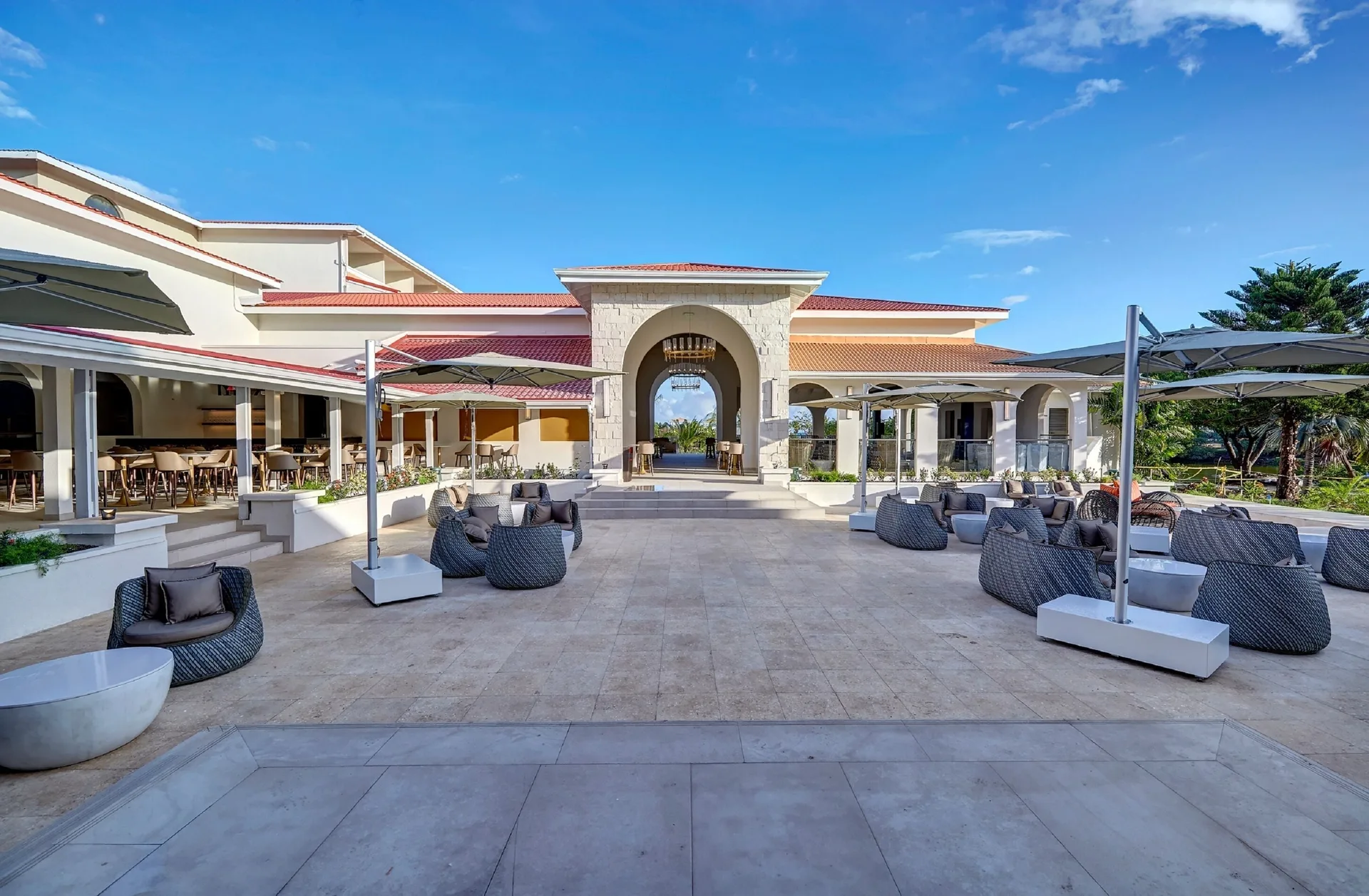 Open-air terrace seating and arched entrance at Royalton Grenada.