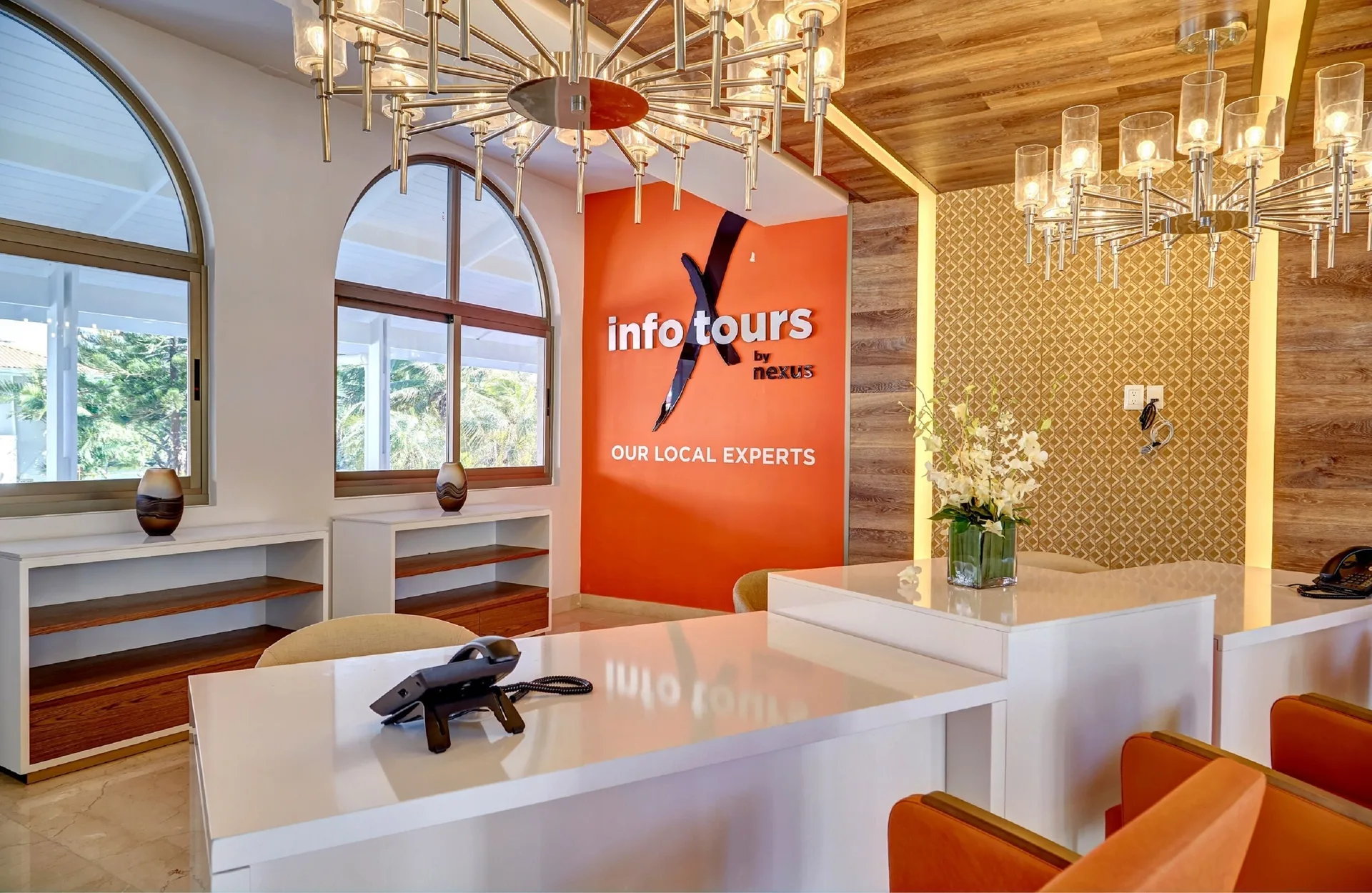 Tour desk office with orange wall signage at Royalton Grenada.