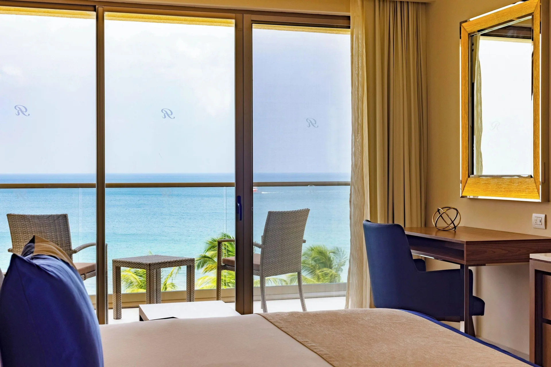 Chairman Two Bedroom Suite bedroom balcony view and desk at Royalton Grenada.