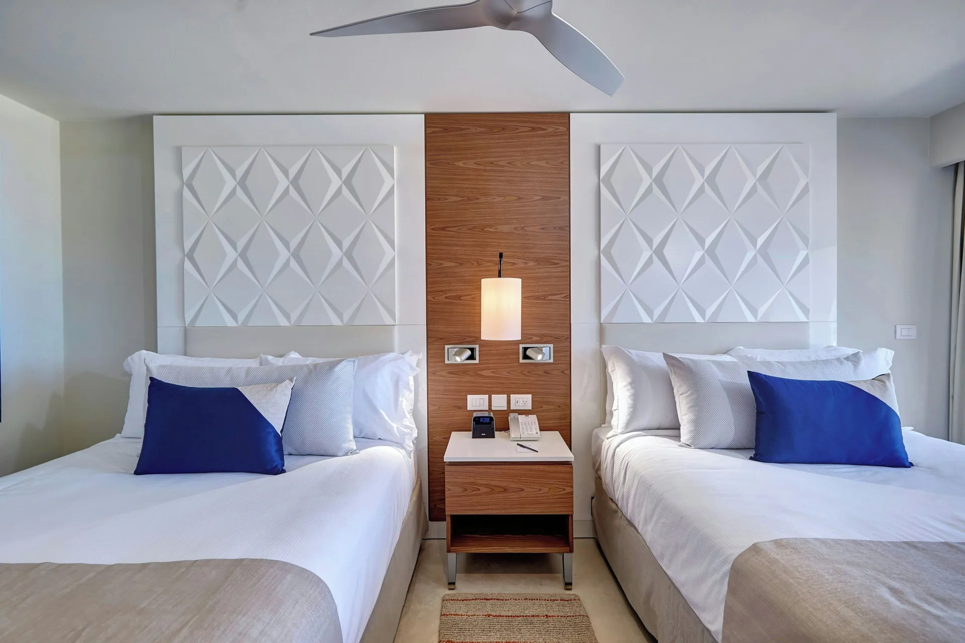 Luxury Room two beds with central nightstand at Royalton Grenada.