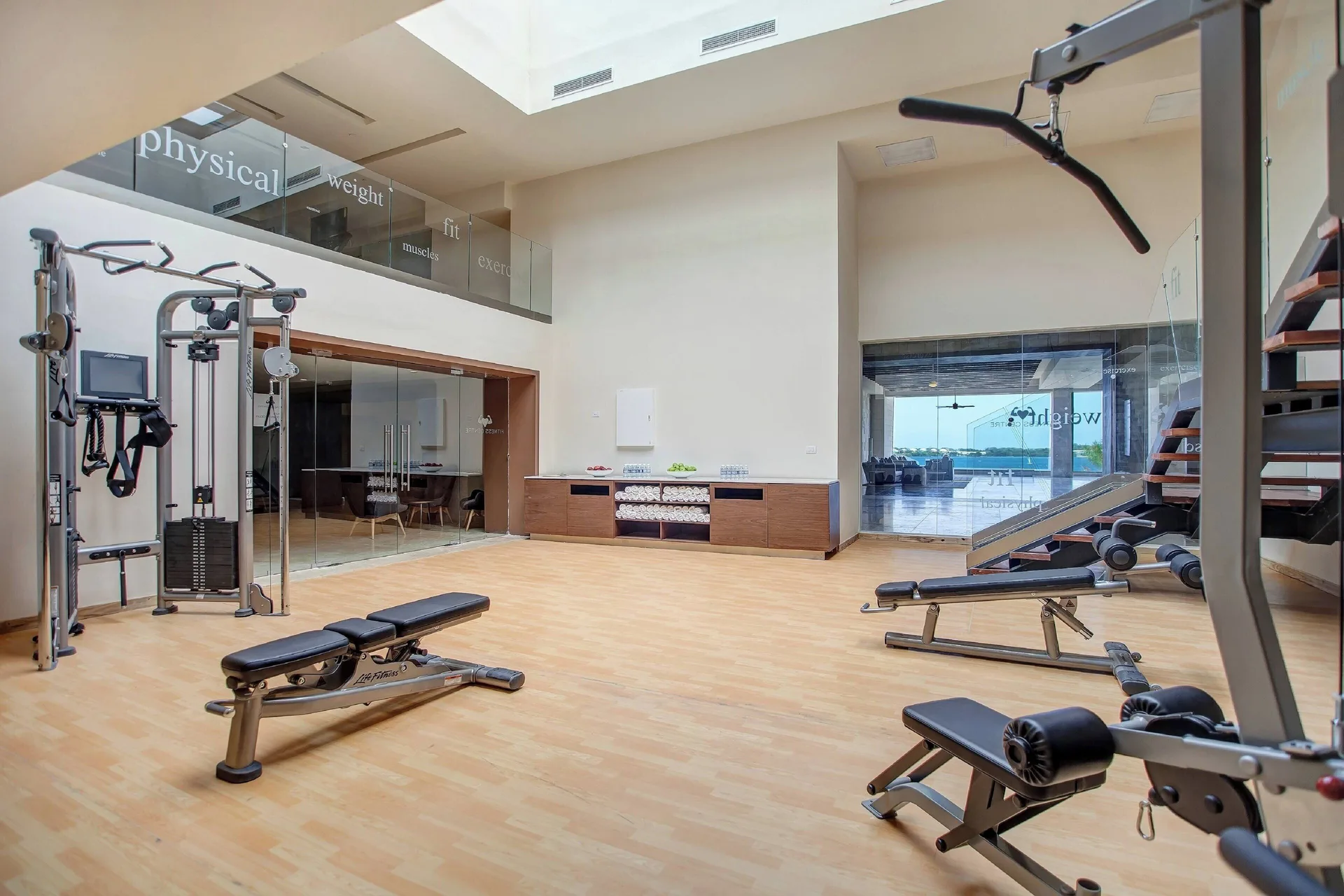 Fitness center with cable machines and benches at Royalton Negril.
