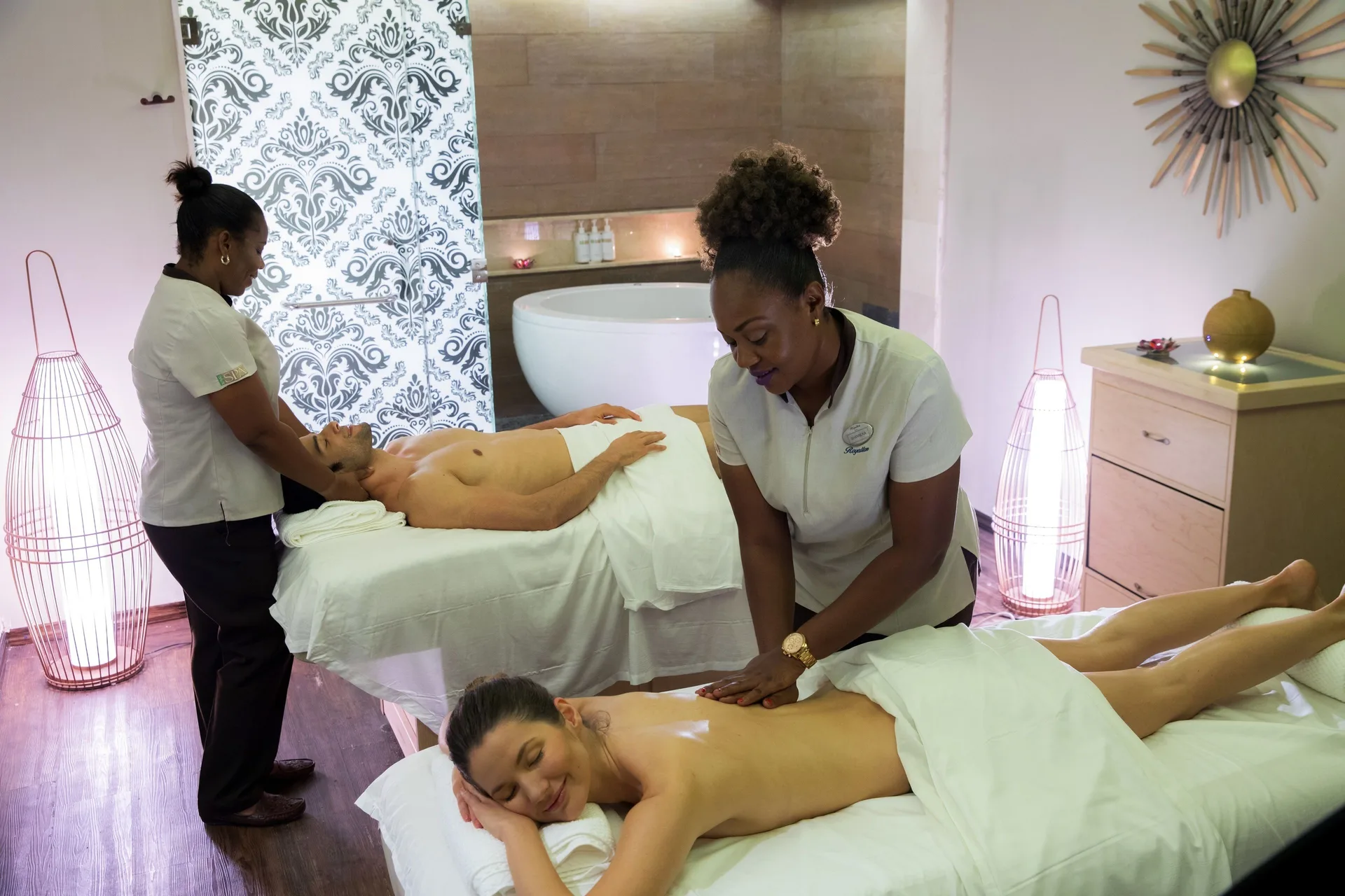 Spa therapists provide massages in a treatment room at Royalton Negril.