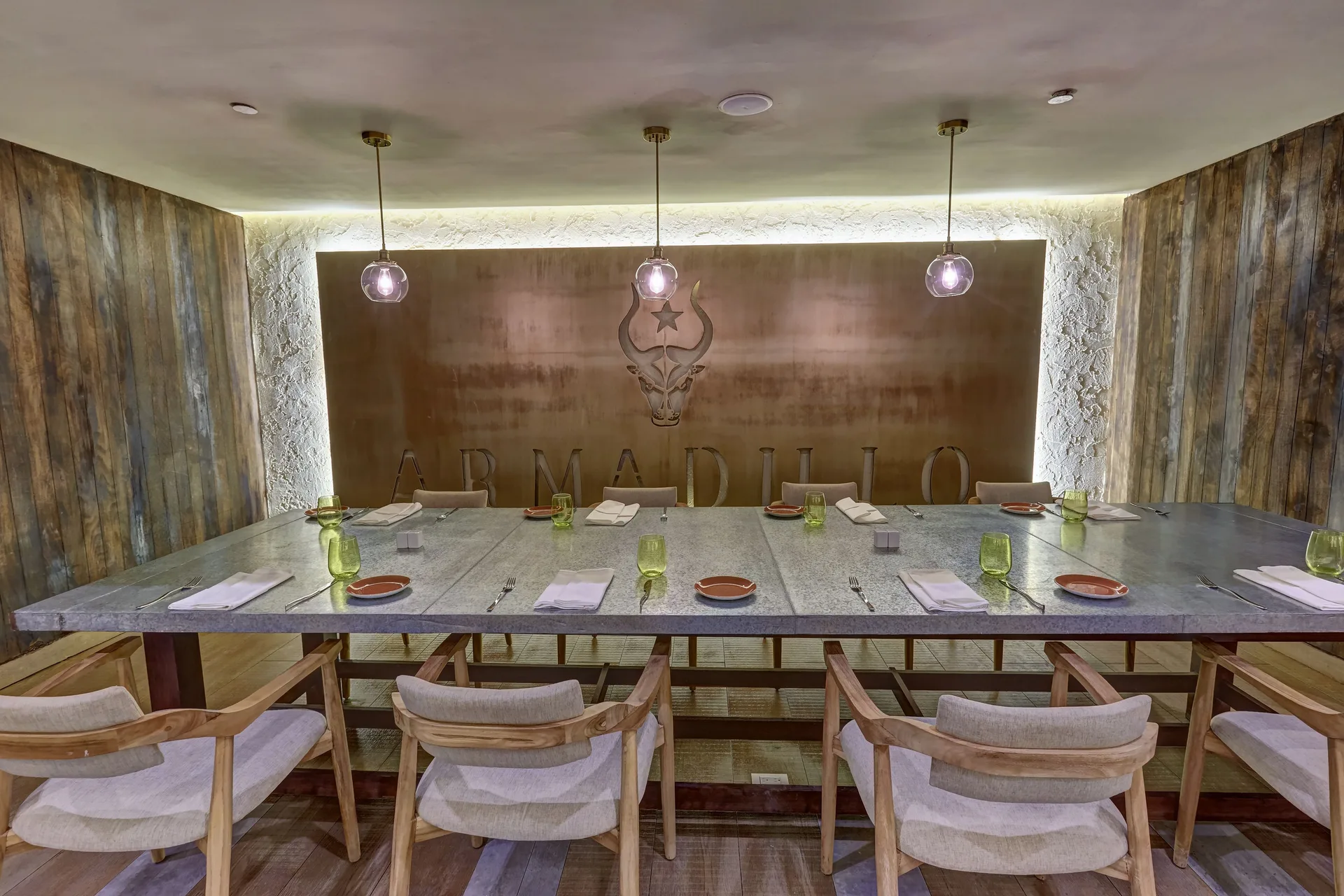 Armadillo private dining table with wood walls at Royalton Negril.