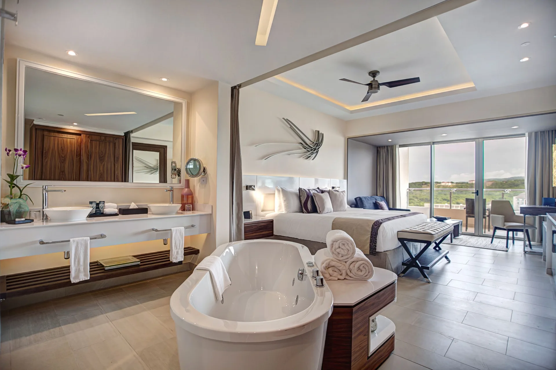 Luxury Junior Suite with king bed, soaking tub, and balcony at Royalton Negril.
