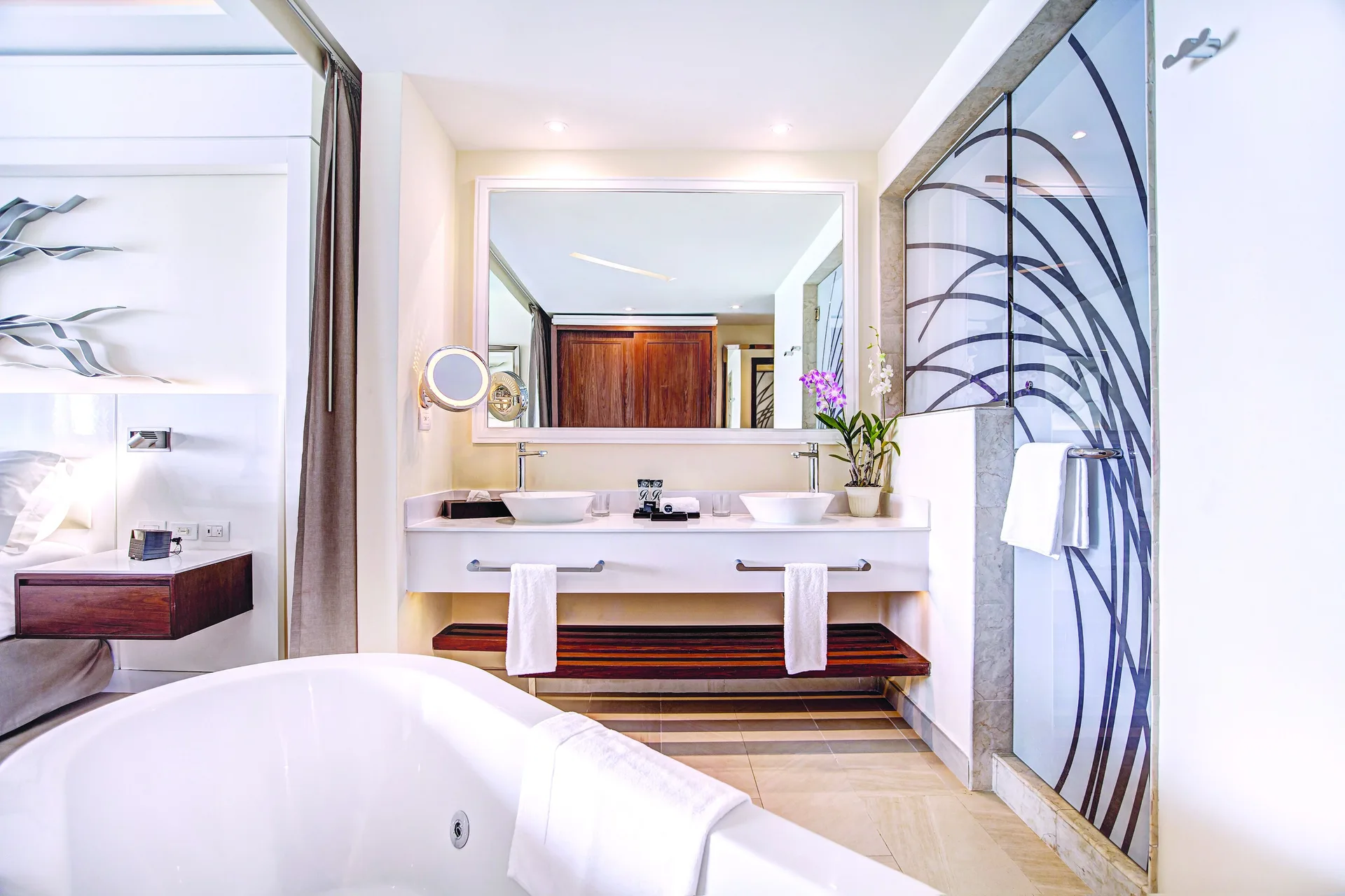 Luxury Junior Suite bathroom with soaking tub and double vanity at Royalton Negril.