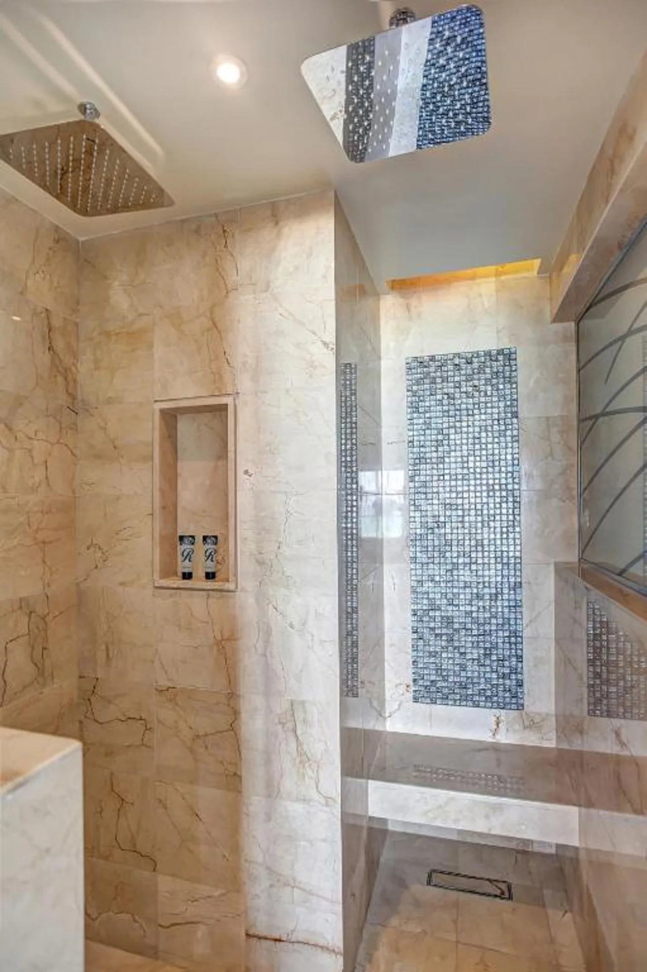Luxury Junior Suite marble shower with rainfall heads at Royalton Negril.