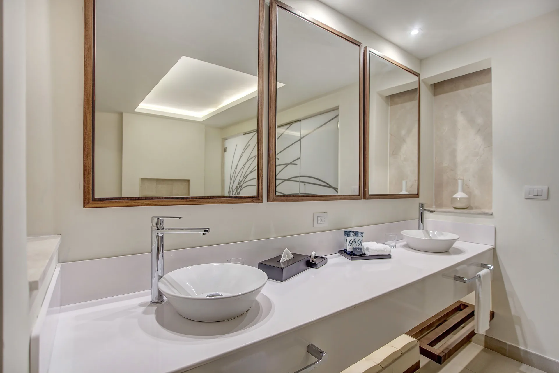 Double-sink bathroom vanity in a Luxury Presidential suite at Royalton Negril with large mirrors.